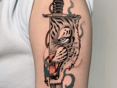 Tattoo of a tiger emerging from a sword on an arm