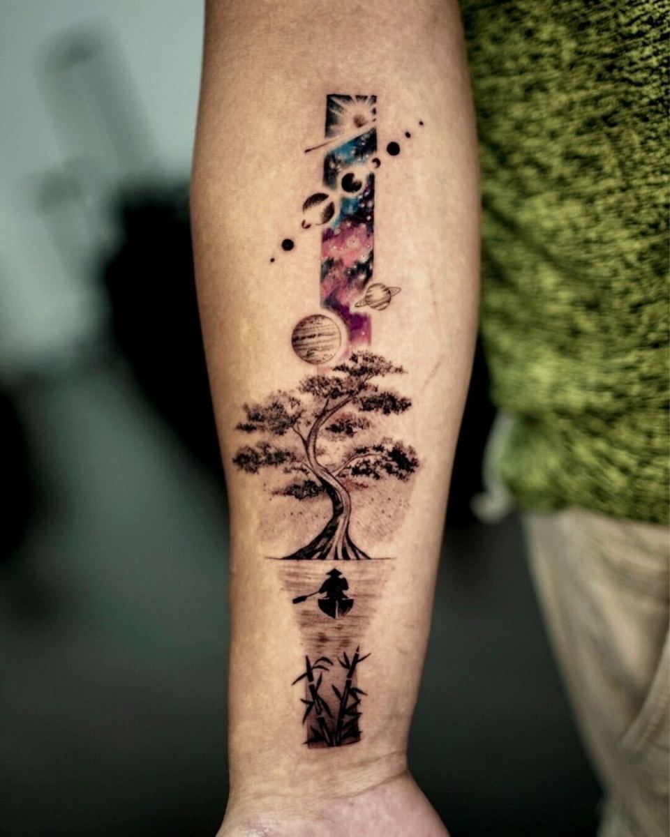 A detailed tattoo design showcasing a tree surrounded by planets and cosmic elements.