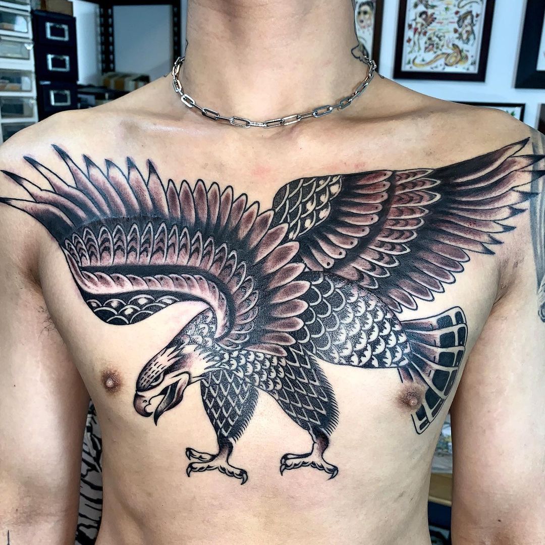 Detailed tattoo of an eagle on a man's chest