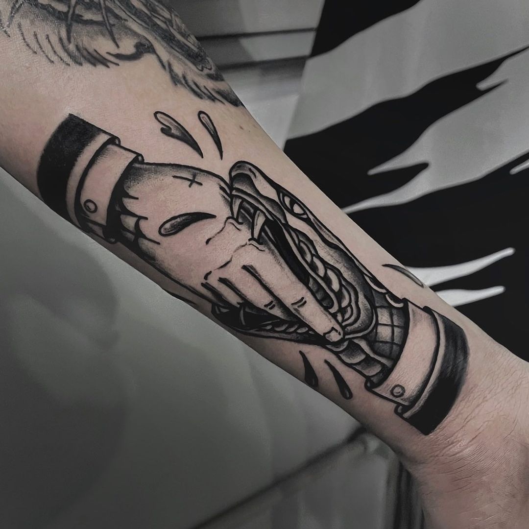Detailed tattoo of a hand reaching for a burger