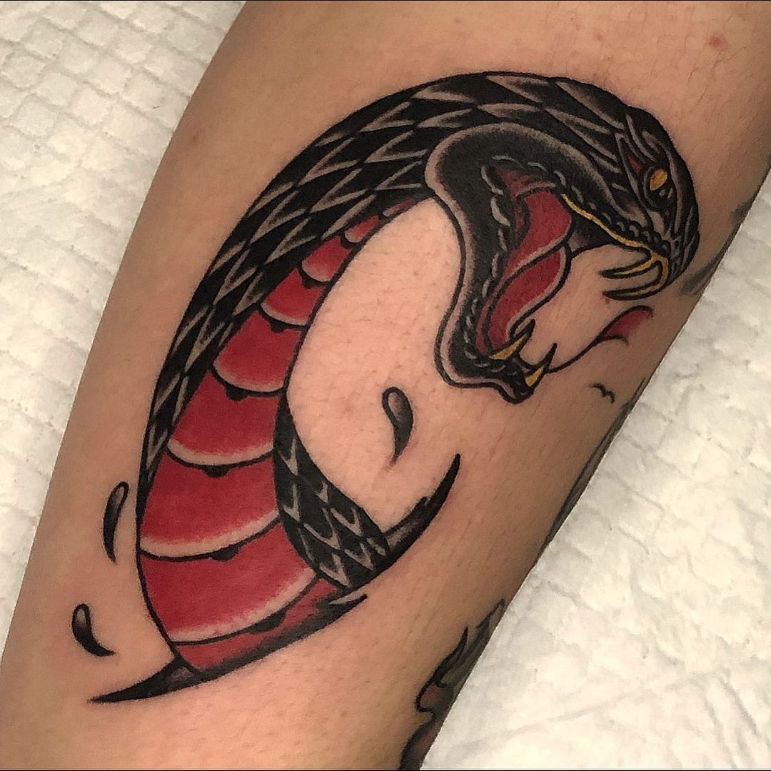 Vibrant snake tattoo with red and black details