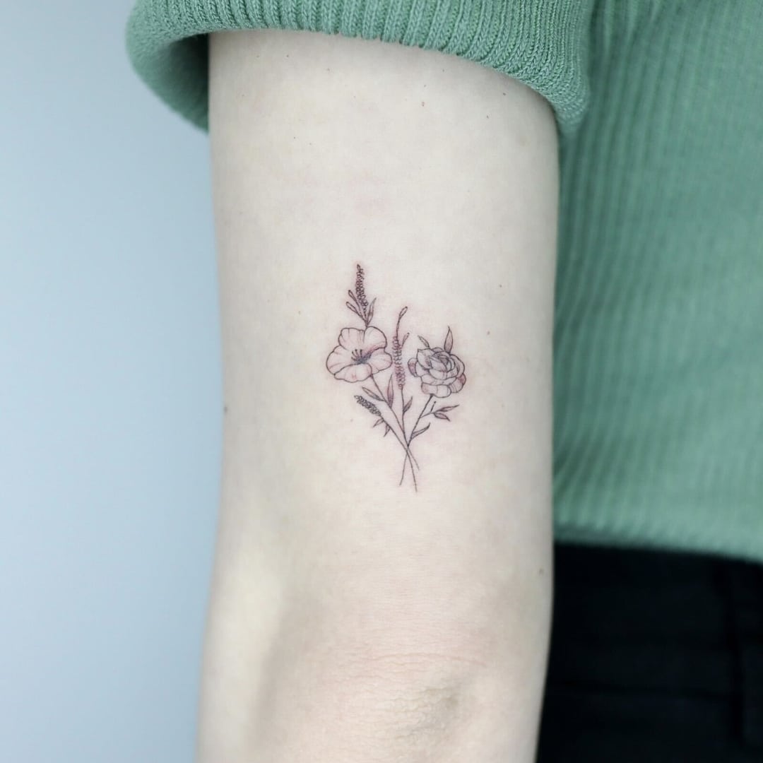 Tattoo of flowers on a person's arm