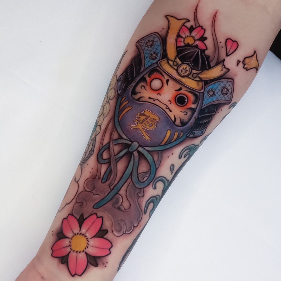 Colorful tattoo of a samurai cat with floral elements