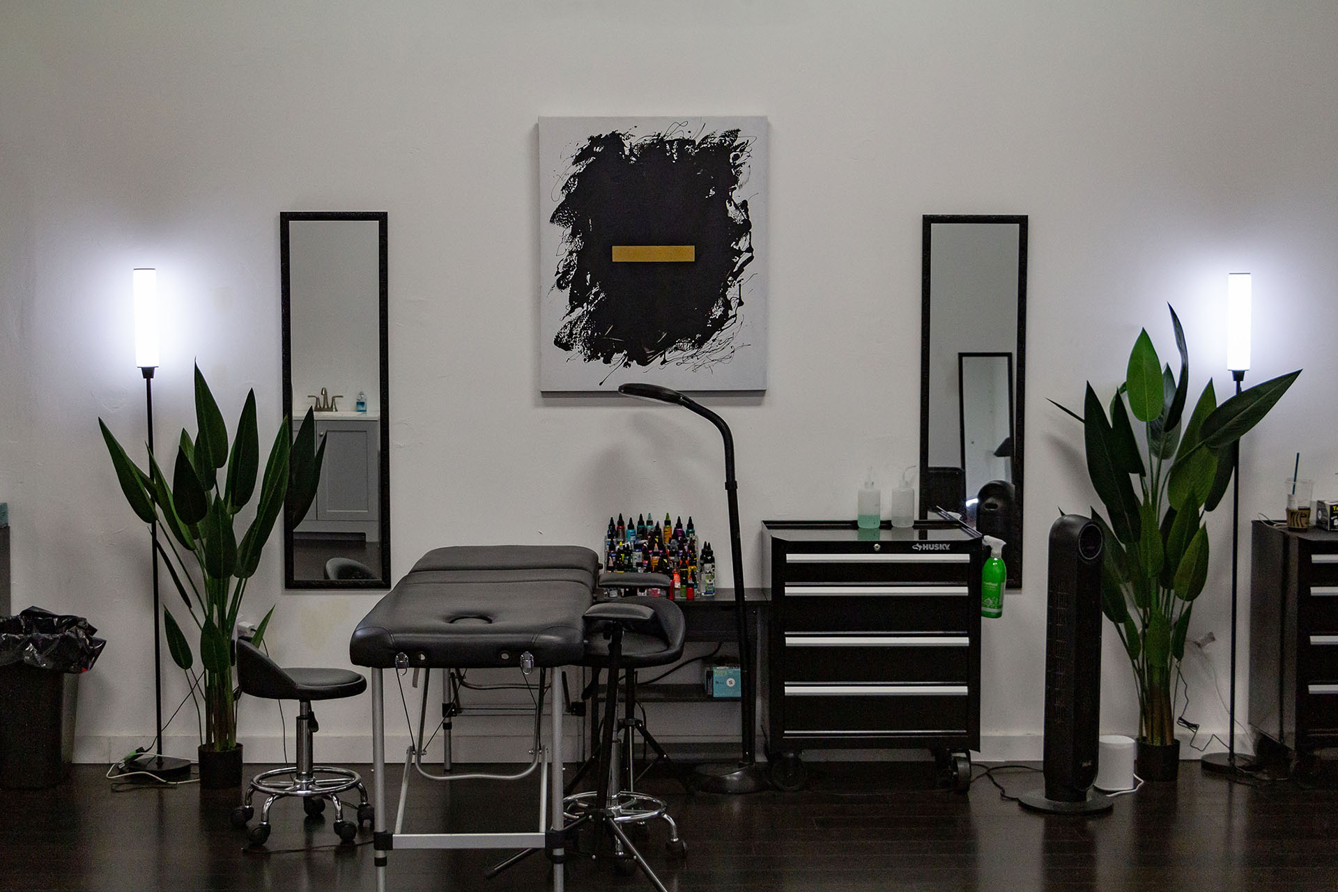 Tattoo studio interior with plants and artwork